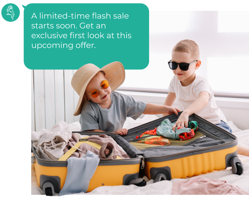 Two kids in sunglasses packing a suitcase