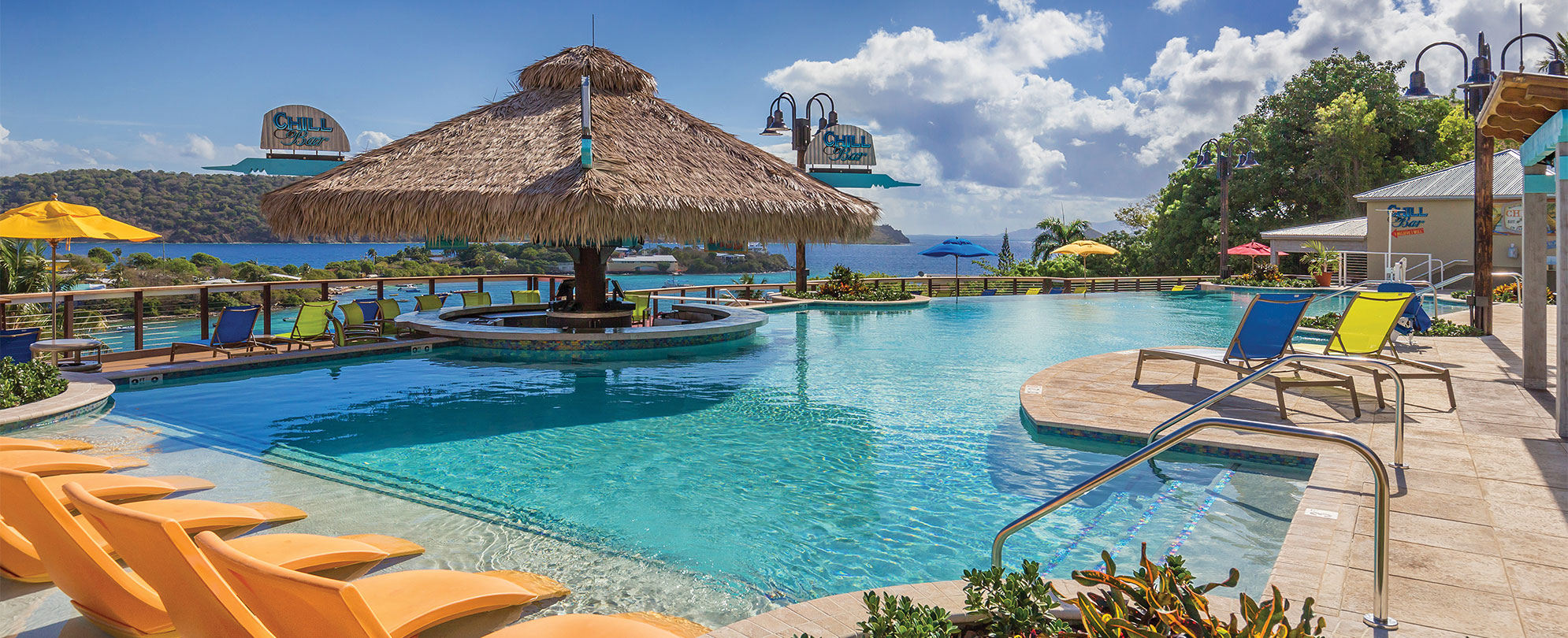 A Margaritaville Vacation Club resort pool area and tiki bar. 