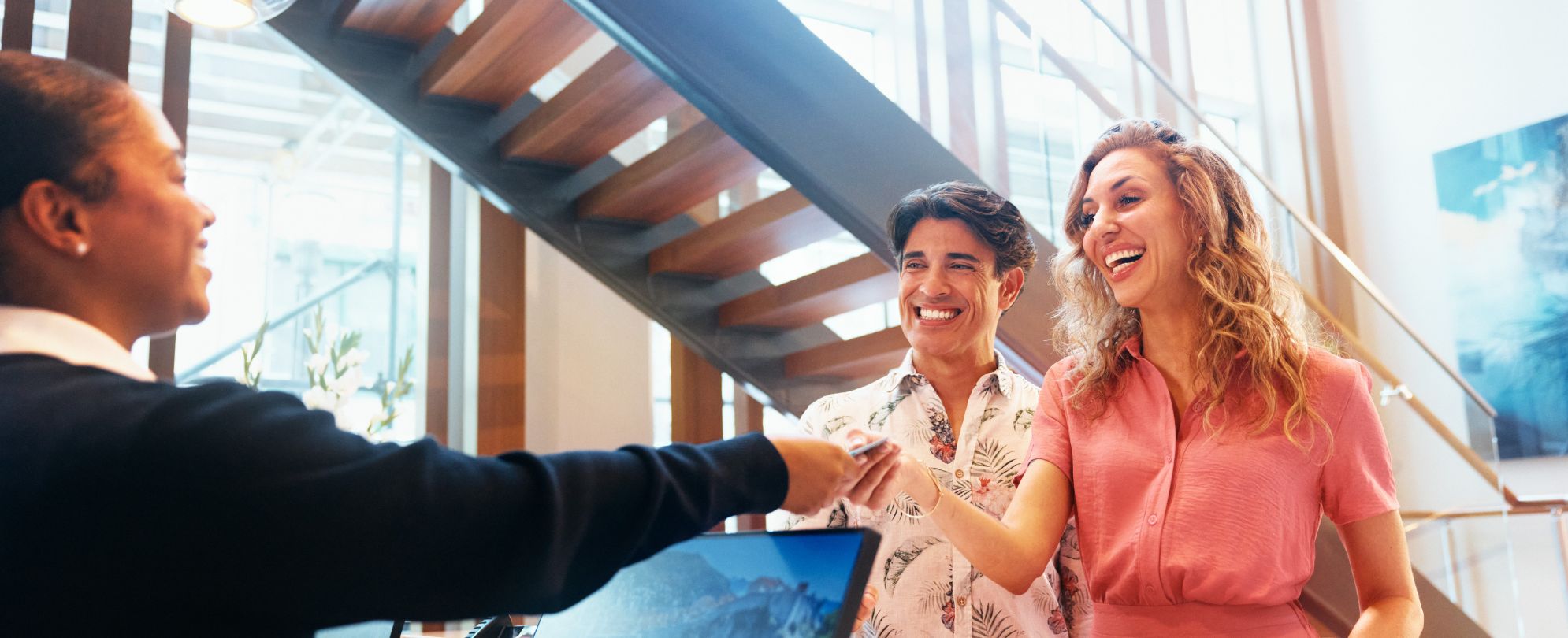 A couple checking in to their Margaritaville Vacation Club vacation