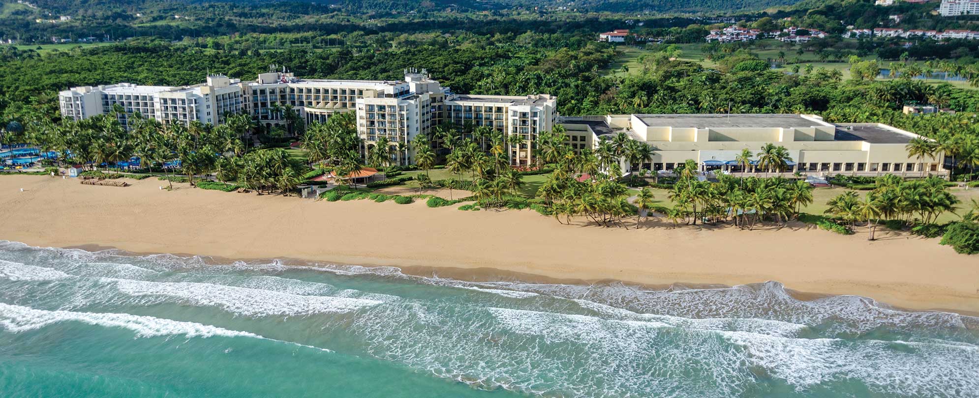 Birds-eye-view of Margaritaville Vacation Club by Wyndham - Rio Mar, an oceanfront timeshare resort in Puerto Rico.