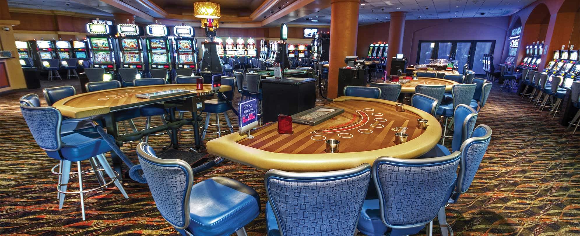 Blackjack tables and slot machines in the casino at Margaritaville Vacation Club by Wyndham - Rio Mar.