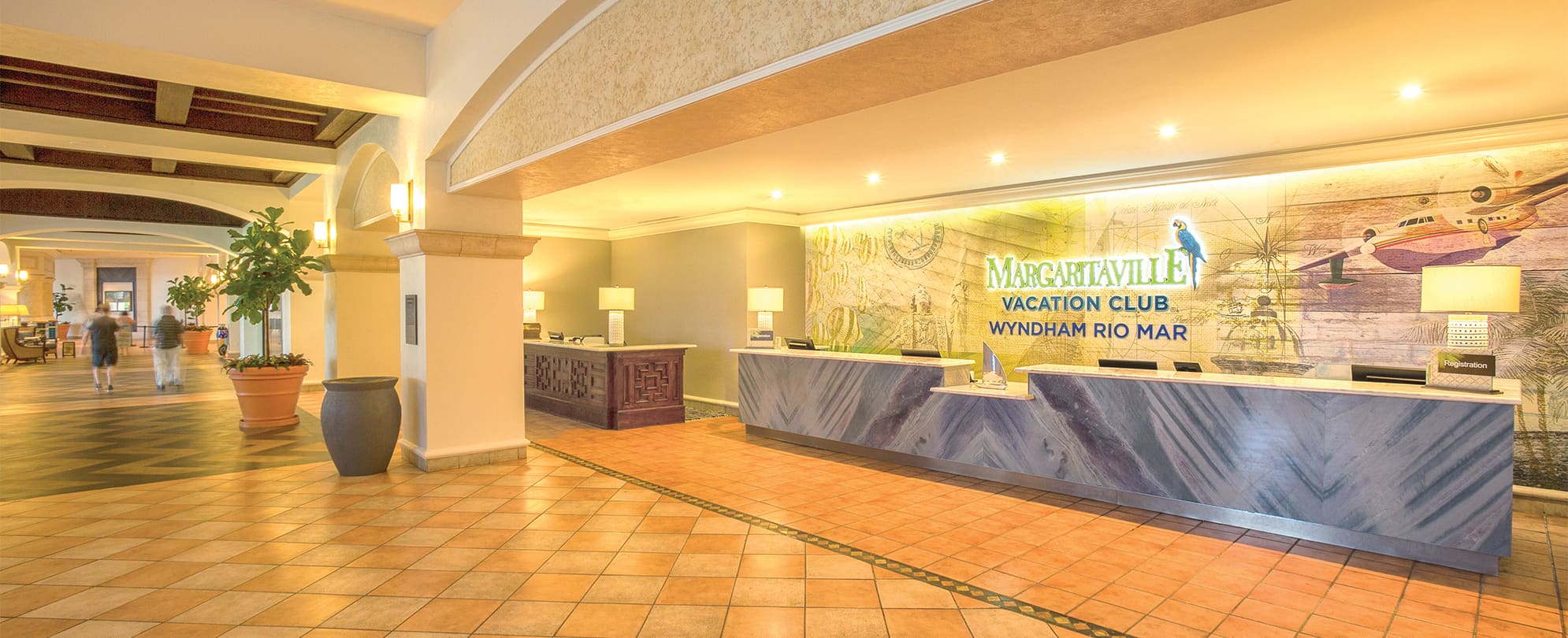 Lobby check-in counters at Margaritaville Vacation Club by Wyndham - Rio Mar, a Puerto Rico timeshare resort.