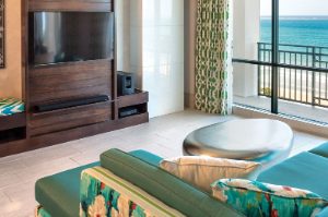 Living room with an ocean view in a Presidential Reserve suite at Margaritaville Vacation Club by Wyndham - Rio Mar.