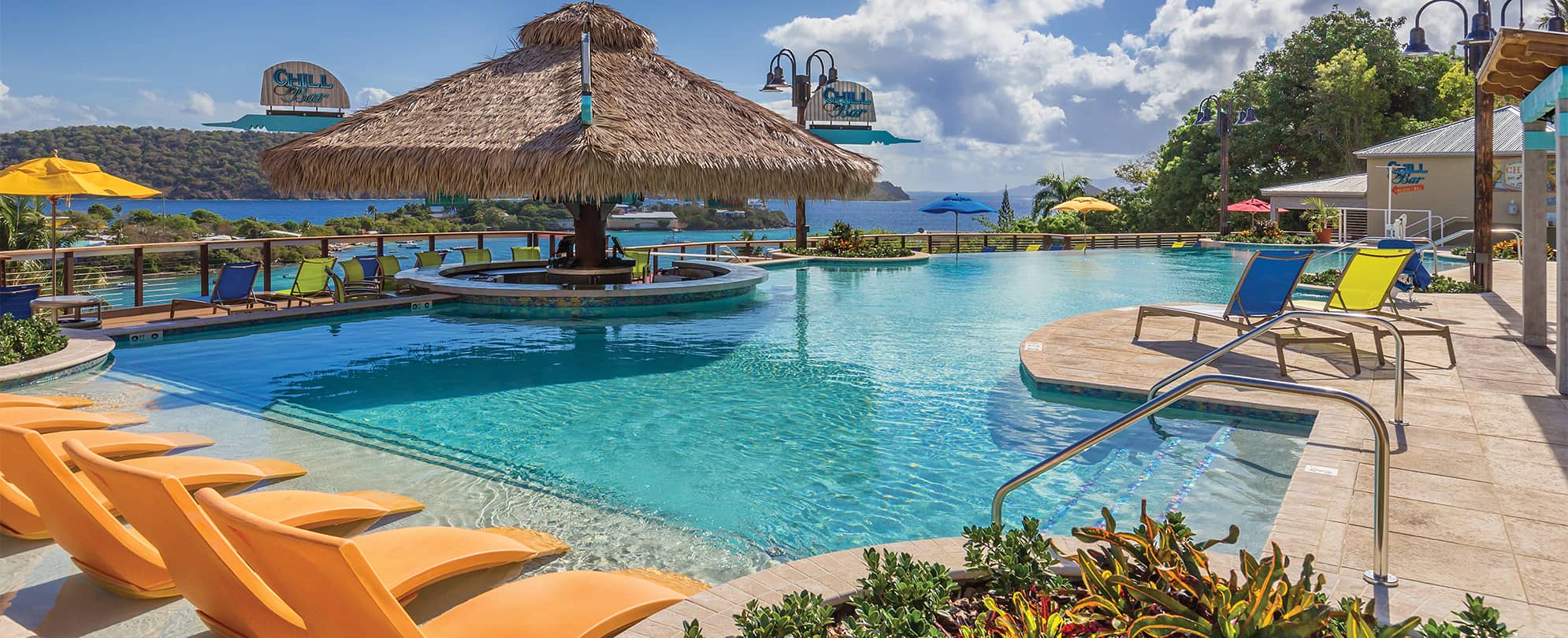 The oceanfront pool and swim-up tiki bar at Margaritaville Vacation Club by Wyndham - St. Thomas, a timeshare resort.