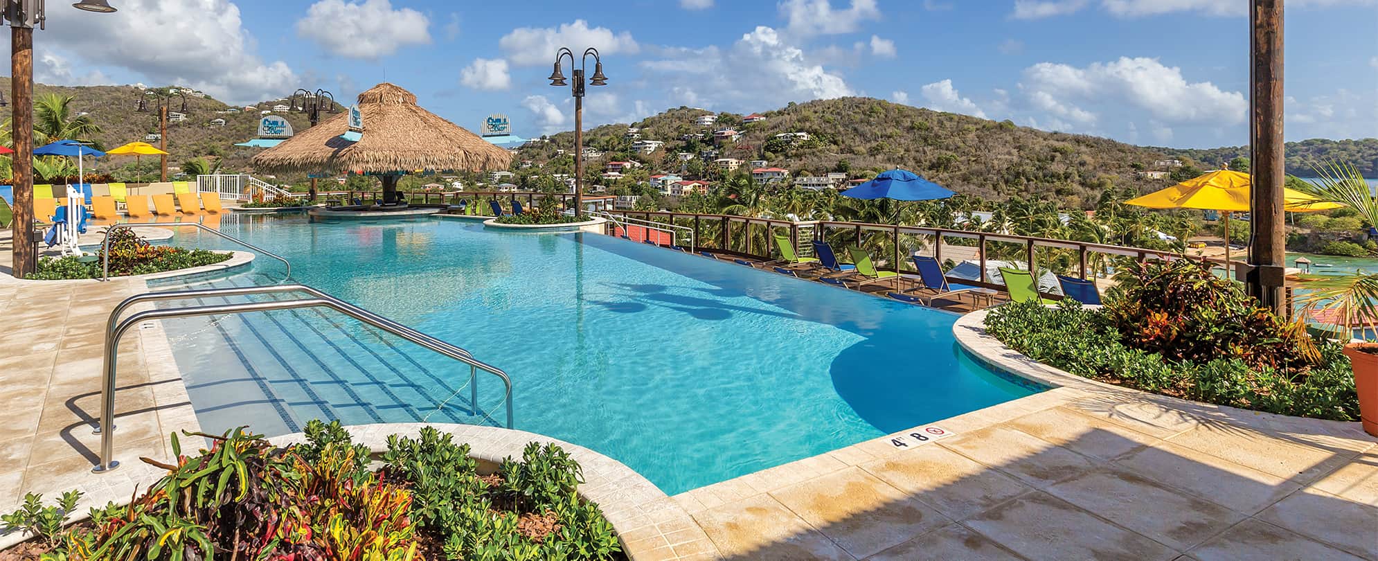 A pool overlooking ocean and mountains in the U.S. Virgin Islands at Margaritaville Vacation Club by Wyndham - St. Thomas.