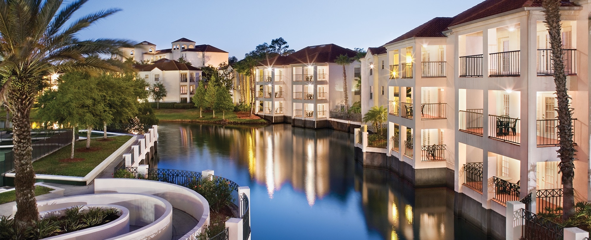 The buildings and balconies of Club Wyndham Star Island, a timeshare resort in Kissimmee, FL, situated along a canal.