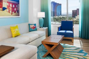 Chic living room with colorful pillows at Margaritaville Vacation Club by Wyndham - Desert Blue in Las Vegas, NV.