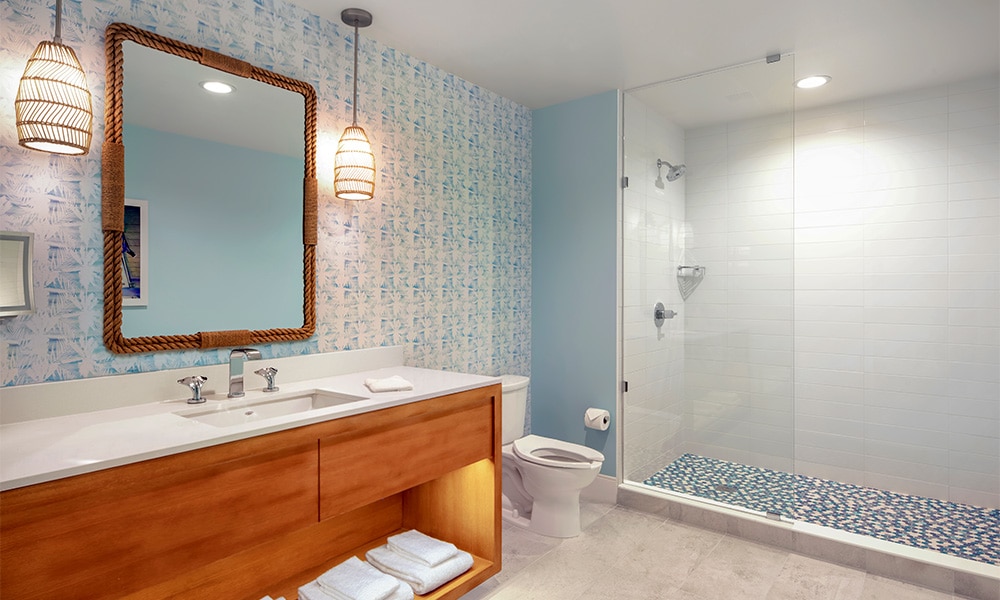 A Margaritaville Vacation Club Studio suite sink, toilet, and walk-in shower at the Nashville, TN resort. 